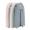 Three folding travel hangers, folded