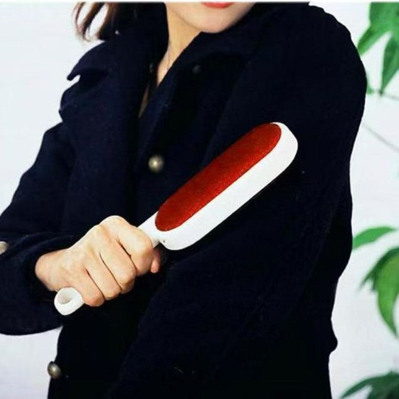 Lint brush used on a dark coat