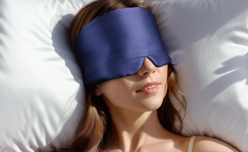 Navy sleep mask being worn